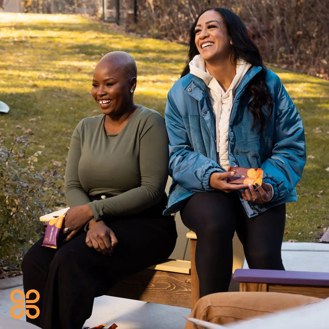 image of two women outside enjoying the low histamine protein bars