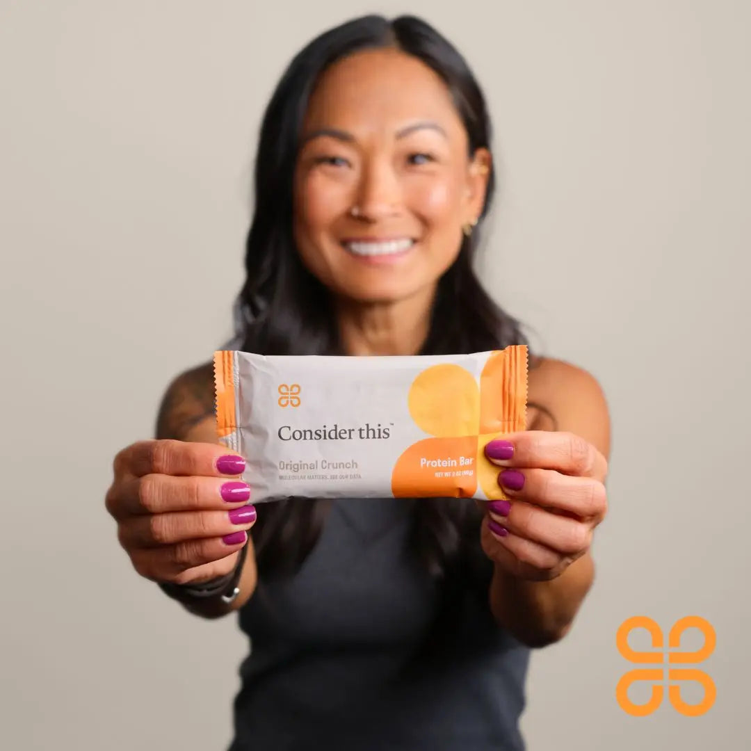 image of a woman showing the protein bars
